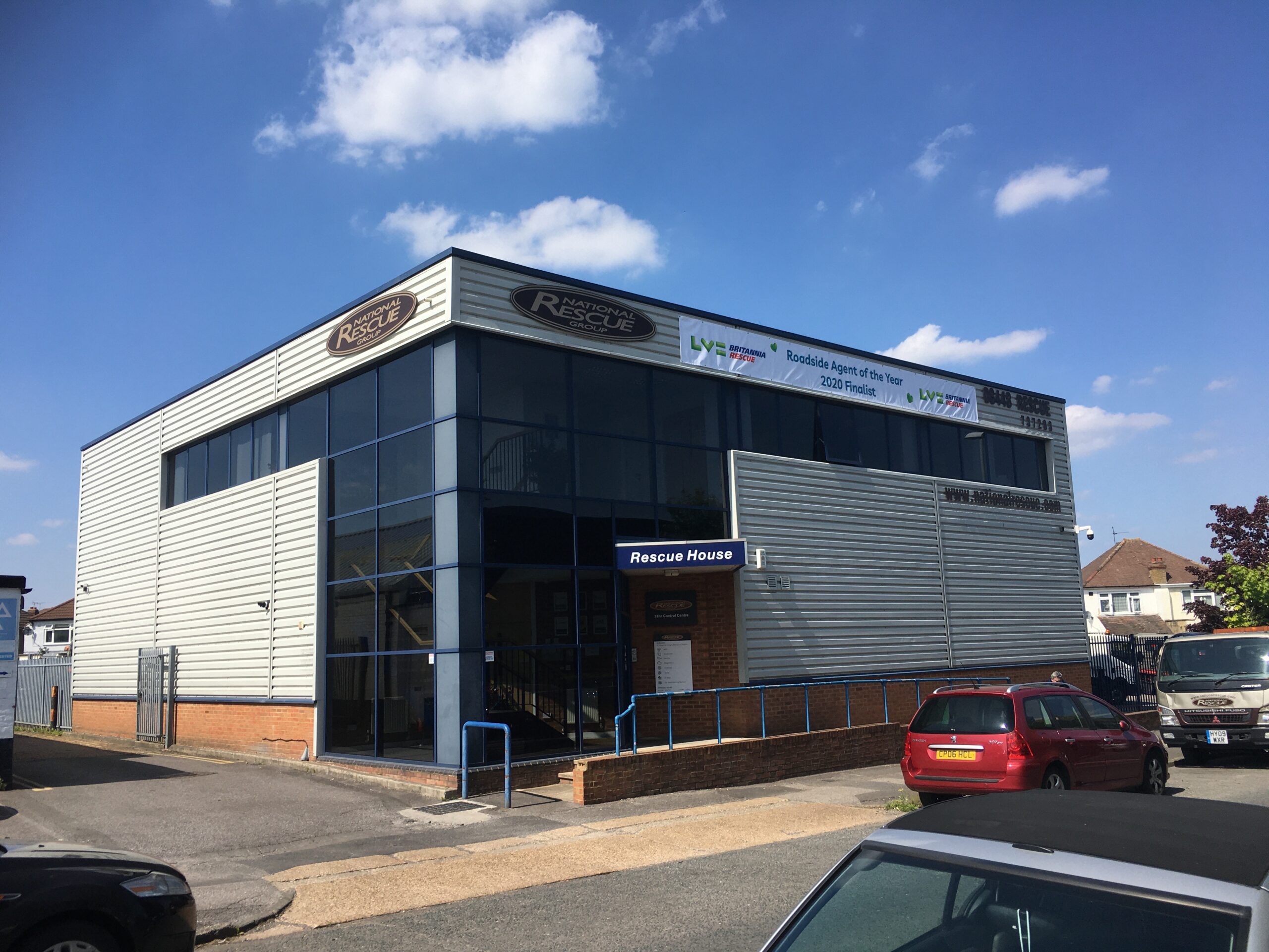 National Rescue Group's Rescue House, a modern two-story building with large windows and signage
